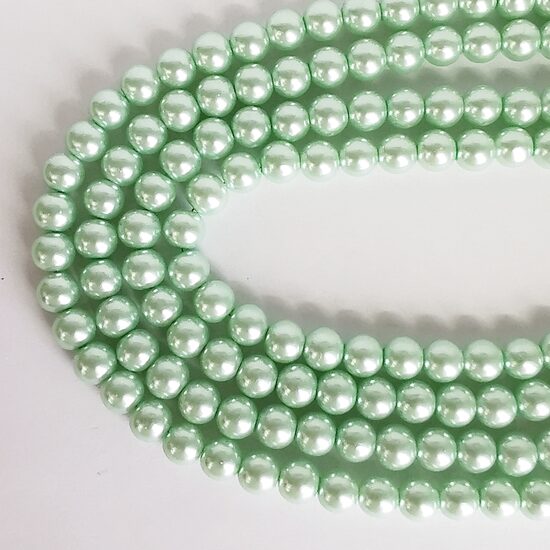 10 mm gaiši zaļa. Stikla pērļu virtene ar pārklājumu